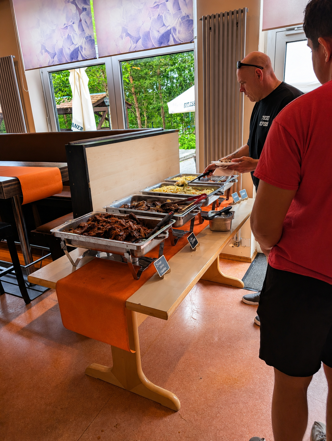 Buffet setup with BBQ and sides for a private event