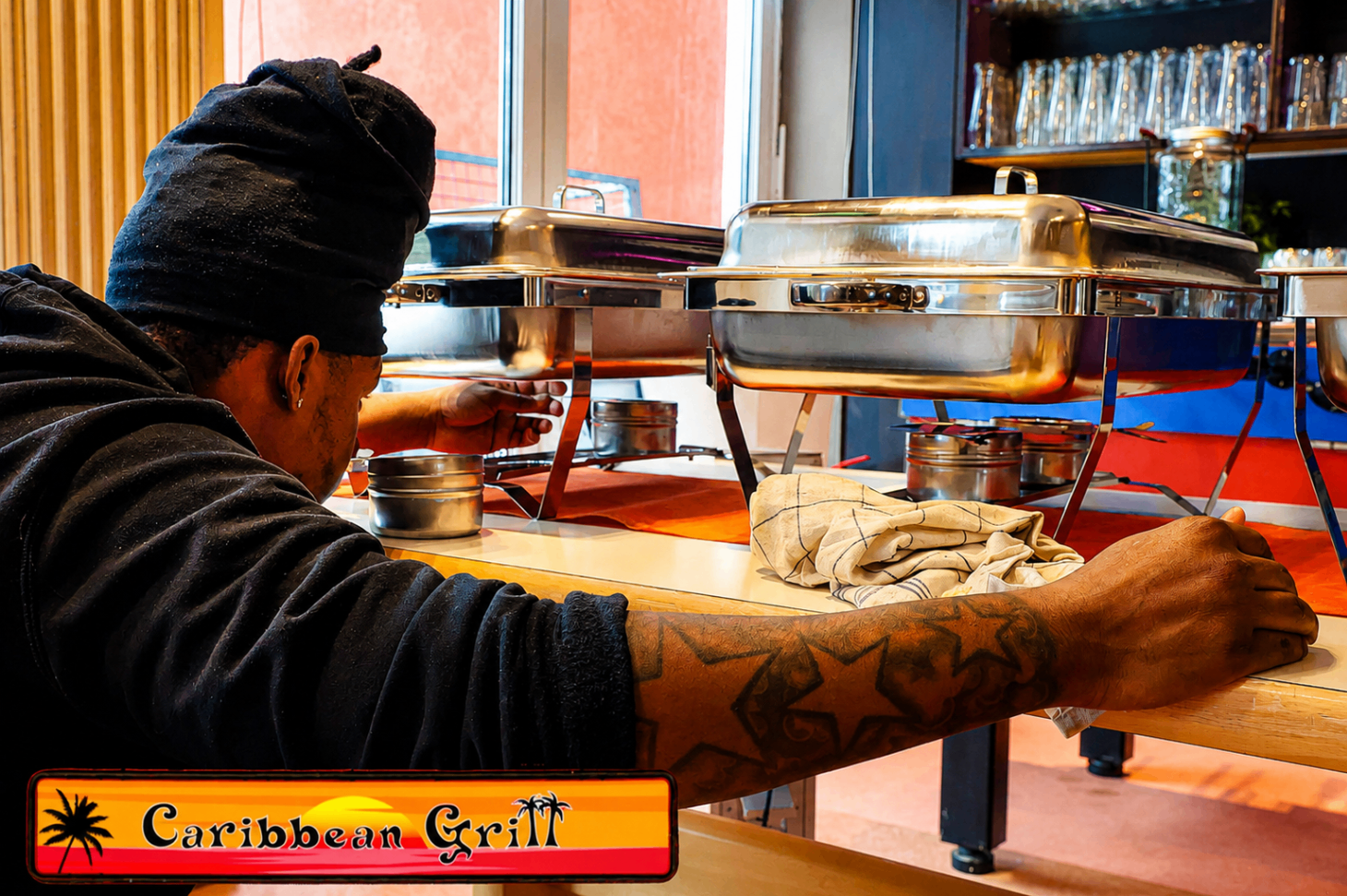 Team member setting up chafing dishes for brunch