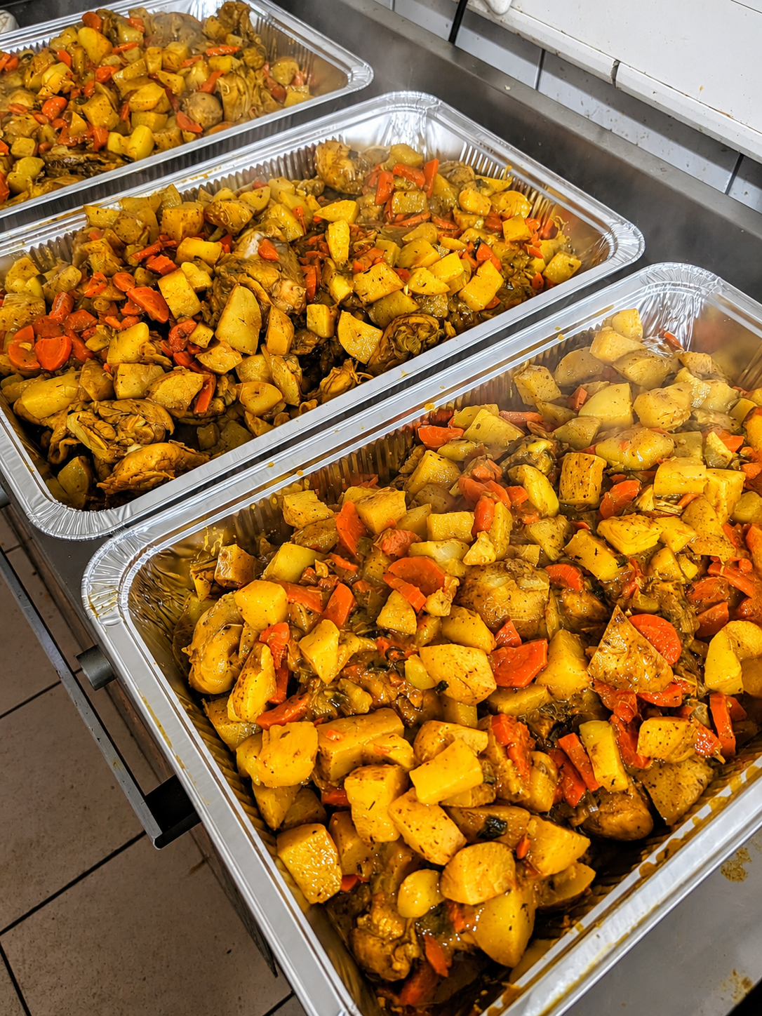 Curry potatoes with vegetables for a catering order
